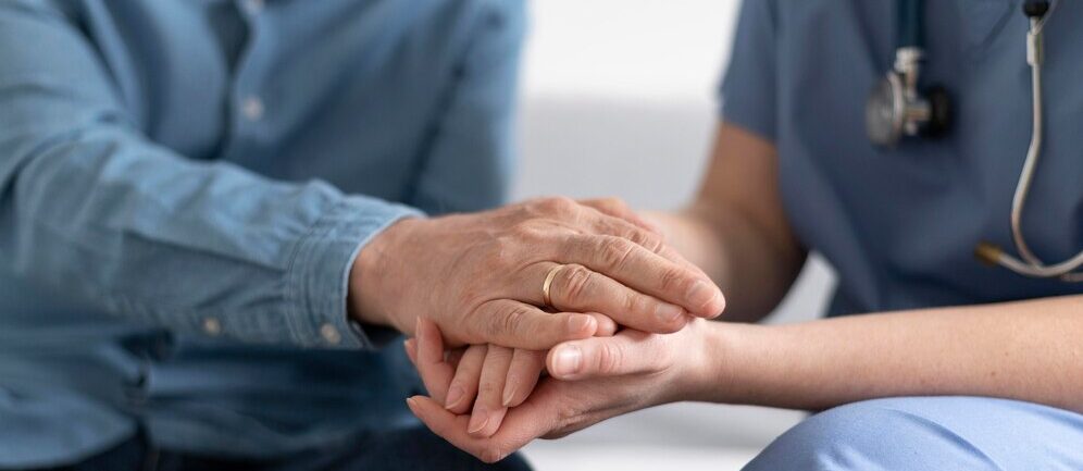 Holding hand empathy with patient